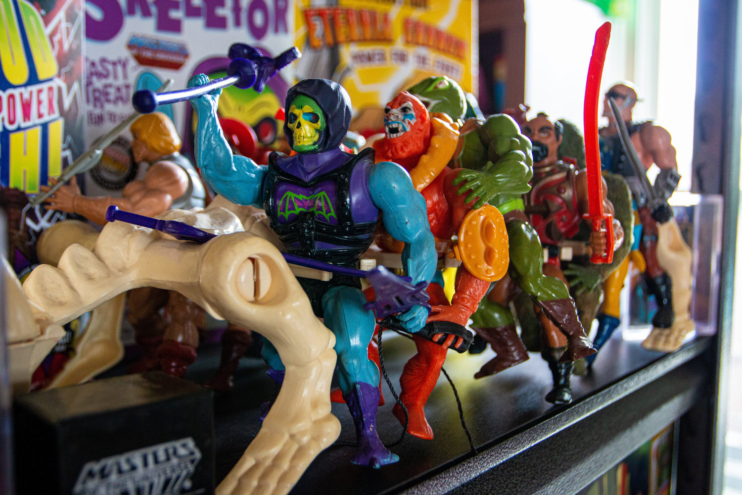 "Masters of the Universe" characters riding on a skeleton.